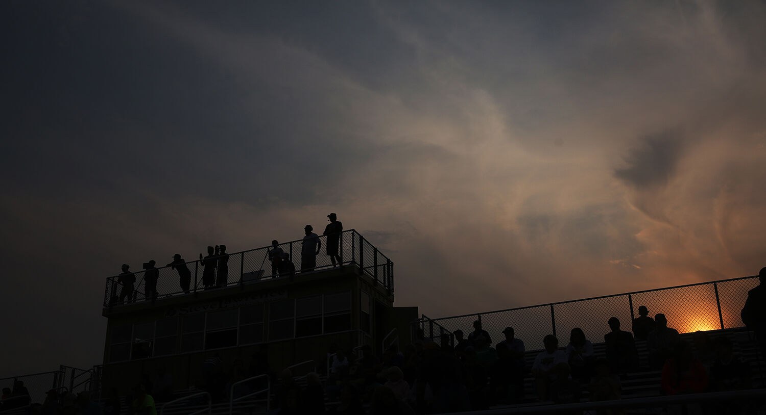 Fans spread out amongst the stands and game filmer’s set up on top of the press box
